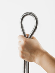 Shower hose in hand. Isolated on a white background.