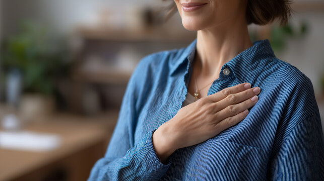 Person making loyalty promise oath with hand gesture, individual swearing with hand on chest formally raised, commitment and dedication symbolic pose at home setting, sincere pledg