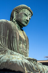 Fototapeta premium Great Buddha of Kamakura, Japan. The bronzed Great Buddha of Kamakura or Kamakura Daibutsu