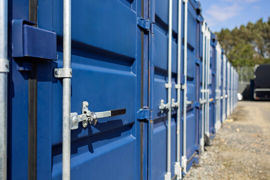 Perspective View of Blue Storage Containers in Industrial Yard
