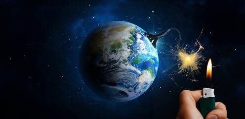 Fototapeta premium Earth globe with bomb fuse ignited by man with lighter in space. Anthropogenic planetary crisis, world destruction