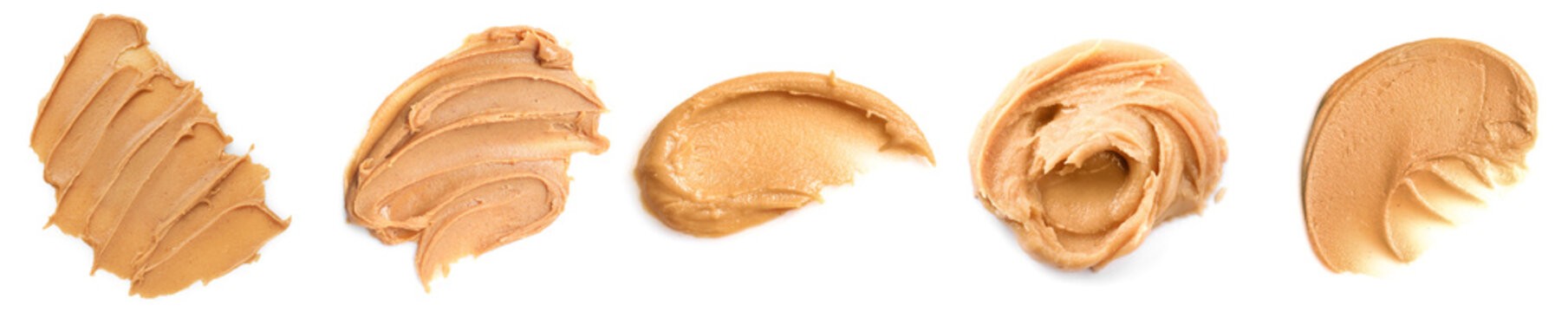 Tasty peanut butter, top view. Collection of spread smears isolated on white