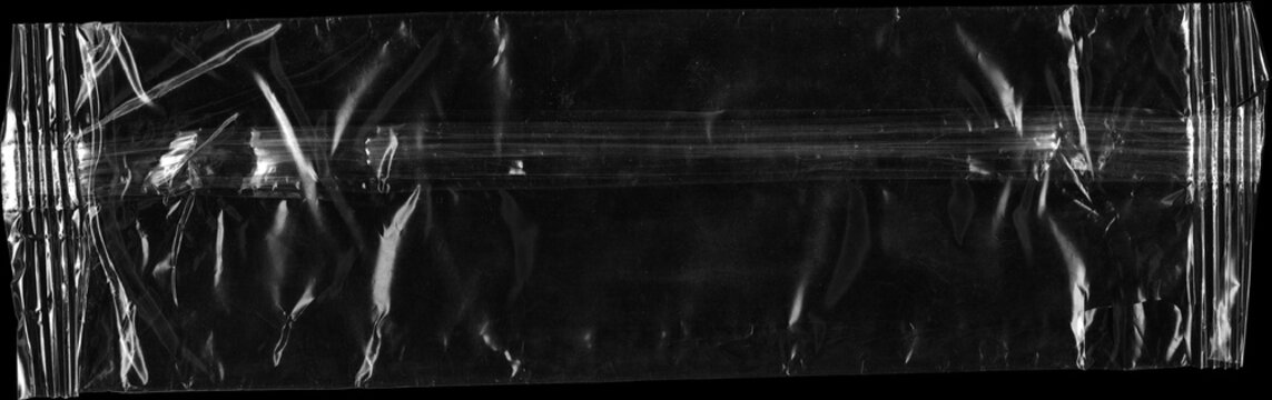 Textura plastica. Plastic film wrap texture background. transparent plastic film wrap overlay texture background. Textura de pl&aacute;stico. sobre fondo negro