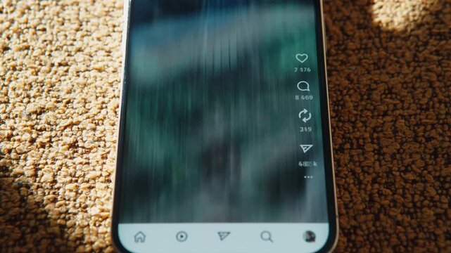 Modern smartphone lying on couch, social media feed rapidly scrolling on screen in timelapse. Motion blur shows nonstop content flow. Digital overload, endless feed, passive media consumption
