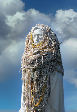 Clouds Surround Statue of Virgin Mary