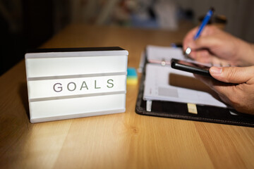 Setting goals and planning tasks using smartphone and notebook