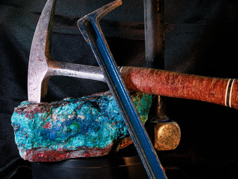 Arizona Copper Mineral Specimen featuring chrysocolla, malachite, shattuckite, azurite, cuprite, tenorite and miner tool props.