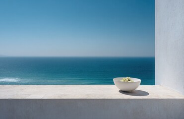 Naklejka premium White Salad Bowl on Ledge Overlooking Blue Ocean