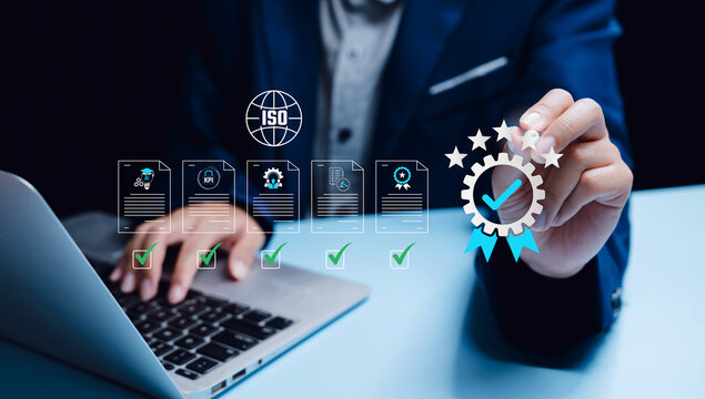 Quality management concept. Businessman approving ISO standard documents and KPI checklist, compliance process, corporate governance, operational excellence