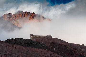 Fototapeta premium Panorama of caucasian Kazbegi mountain and architecture of ancient Georgia. drama sky, mountain peaks, high resolution photo.