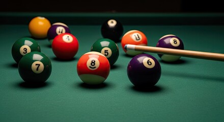 Billiard balls on green table with cue stick close up for games concept