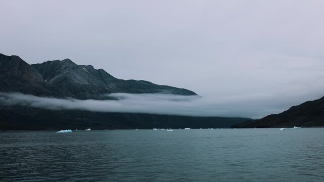 Iceberg and fjord seen from cruise ship vacation in Greenland near Nuuk