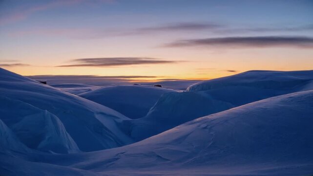 Snowy landscape with blue hills and a colorful sky at sunset in a winter wonderland scene arctic landscape video