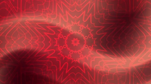 Red abstract starburst pattern with blurred background suitable for graphic design, backgrounds, festive themes, and vibrant art concepts.