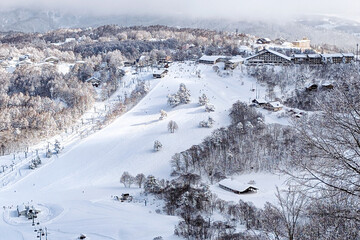 Panoramic winter scene showing hotels and ski runs at Madarao in Nagano Japan