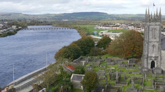 The River Shannon and St. Munchin&rsquo;s Church, the Church of Ireland. As seen from King John's Castle in Limerick, Ireland.