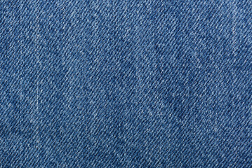 Naklejka premium Washed denim fabric texture background