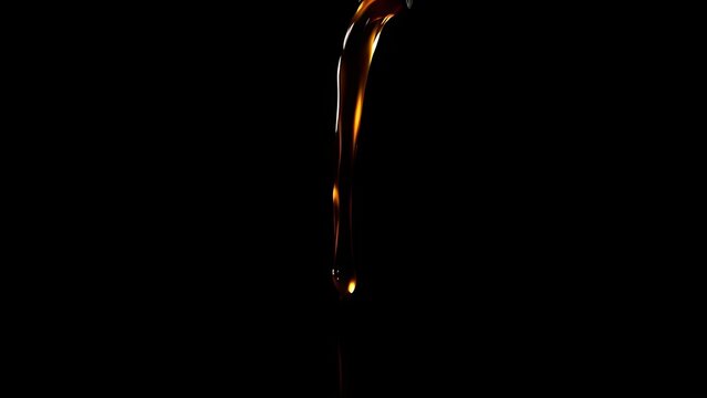 oligarchy. Dark amber liquid pouring from a flagon, creating a smooth arc. bar promotions, beverage menus, designed for product packaging and bar promotions, used by government communicators.
