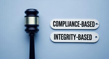 Gavel and Signage Depicting Compliance Based Versus Integrity Based Ethics in Business Law