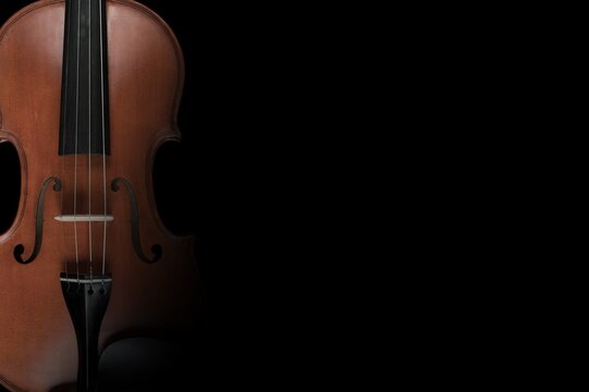 Cello musical instruments on black background