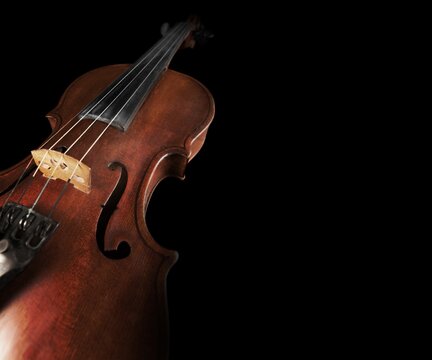 Cello musical instruments on black background