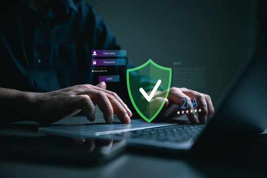 Businessman typing on laptop with secure login interface, shield check icon and two factor authentication concept, cybersecurity protection, data privacy, user verification, safe digital access.