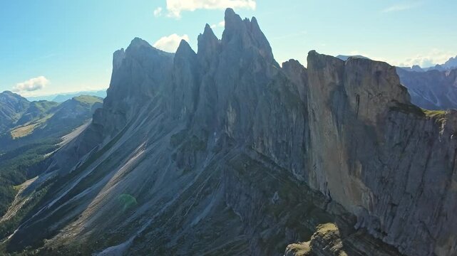 Seceda, Italy, Dolomites Perspective From Sky Uncovers Rugged Mountain Terrain And Illuminated Slopes. Aerial Perspective Provides Detailed Visualization Of Mountain Ranges With Sunlit Valleys