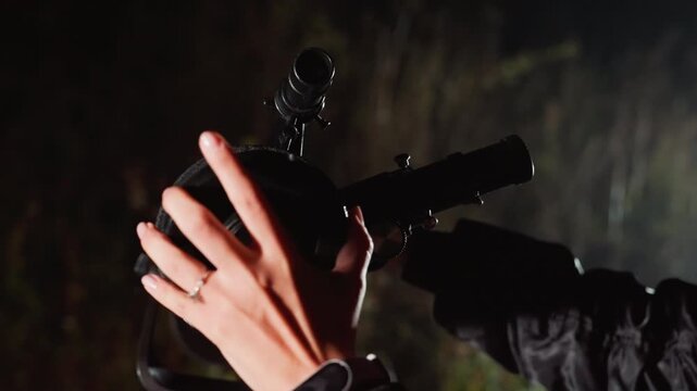 night telescope closeup hands adjusting, backyard astronomer calibrates equatorial mount under faint starlight, dew on optics, gentle bokeh background, slow deliberate movements, wristwatch and ring