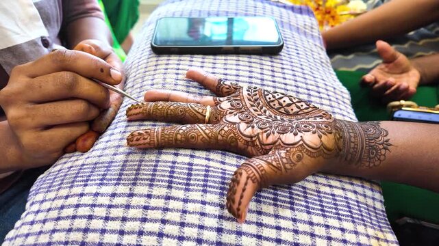 Woman Getting Henna Mehndi Tattoo for Traditional Indian Wedding