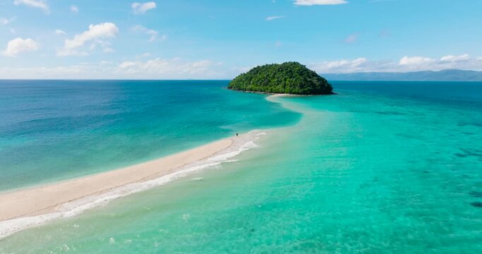 Ocean waves crashing over Bon Bon Sandbank. Beautiful scenery of turquoise sea water. Romblon Island. Romblon, Philippines.