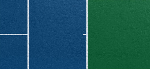 Obraz na płótnie Canvas Blue and green tennis court surface with clear white boundary lines and textured hard court material