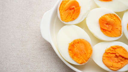 Hard boiled eggs peeled and cut in plate