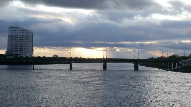 The Shannon Bridge over the River Shannon in Limerick, Ireland. Shot on a cloudy autumn during late afternoon.