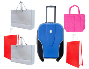 assortment of travel bags and a rolling suitcase