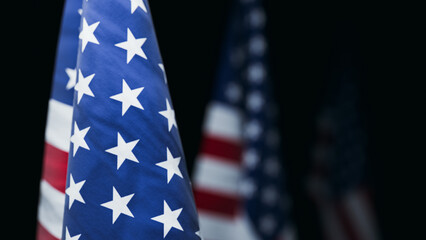 American Flags in Row on Black Background. 3d rendering