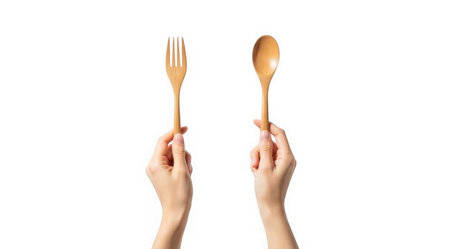 Hands holding golden fork and spoon on transparent background isolated on transparent background