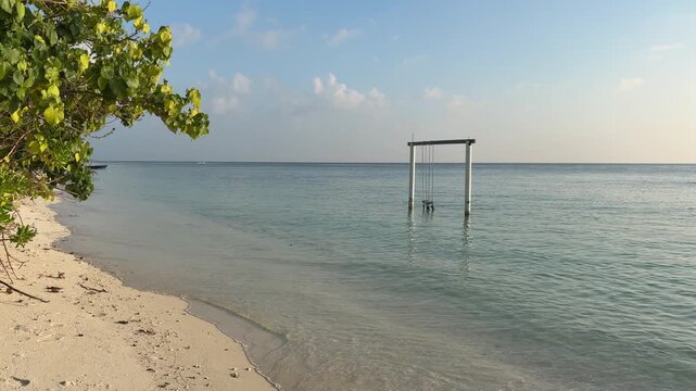 Ukulhas beach Maldives with white sand shoreline and calm turquoise ocean