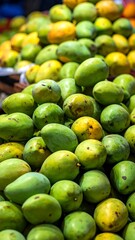 Close-up of a vibrant display of fresh, ripe mangoes, piled high