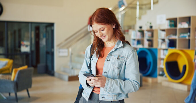 Learning, phone and typing with girl student on high school campus for communication or study. App, education and text message with happy teen learner in corridor for agenda, schedule or timetable
