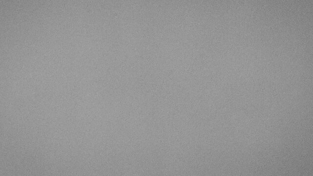 A plain gray background with a subtle texture, providing a neutral and clean canvas for overlaying content or graphics.
