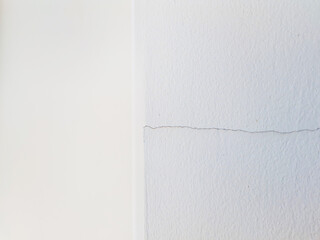 cracked gray concrete wall