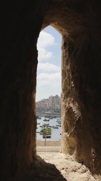 Vertical view of Alexandria Harbor Through Defensive Arrow Slit Window in Qaitbay Citadel Fortress