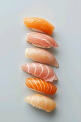 Minimalist sushi nigiri assortment on a light background, premium fresh salmon and tuna seafood composition, elegant japanese cuisine photography style.