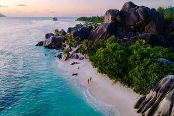 Explore the breathtaking beauty of Anse Source d'Argent beach on La Digue, Seychelles at sunset