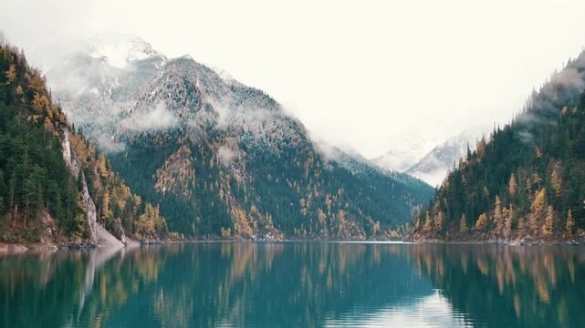 Scenery Jiuzhaigou national park in Sichuan, China. Beautiful Long lake and snow mountain in Autumn season. Famous Landmark and Vacation near Chengdu, China. Asia travel concept