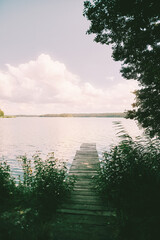 Fototapeta premium Tranquil lake with old wooden jetty