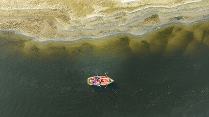 Aerial drone view of the Yamuna River flowing through Mathura, showcasing calm waters, riverbanks, and the sacred landscape of one of India’s most important spiritual cities.