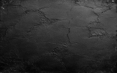 Naklejka premium Grunge black uneven stone texture background with cracks and stains