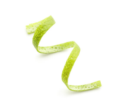 Fresh lime peel isolated on white background, closeup