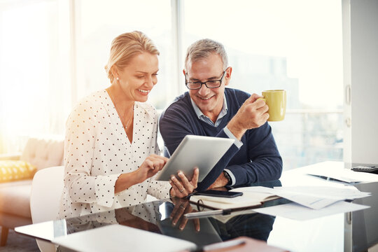 Smile, couple and reading with tablet at house for research, balance and financial payment. Mature people, digital and coffee for online banking, household expenses and loan application for mortgage